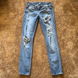 American Eagle Low Rise Distressed Blue Jeans. Size 2.
